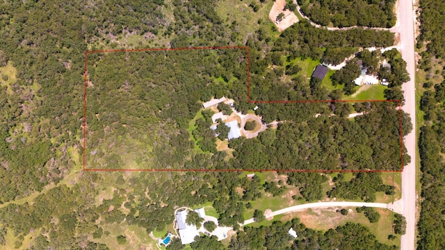 aerial view featuring a wooded view