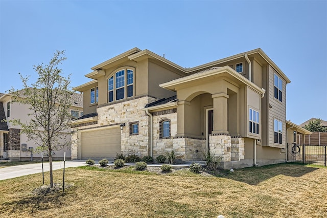 view of front of house with a garage and a front lawn