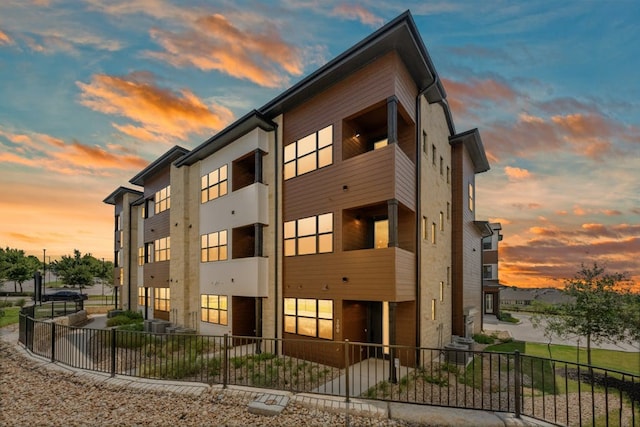 view of outdoor building at dusk