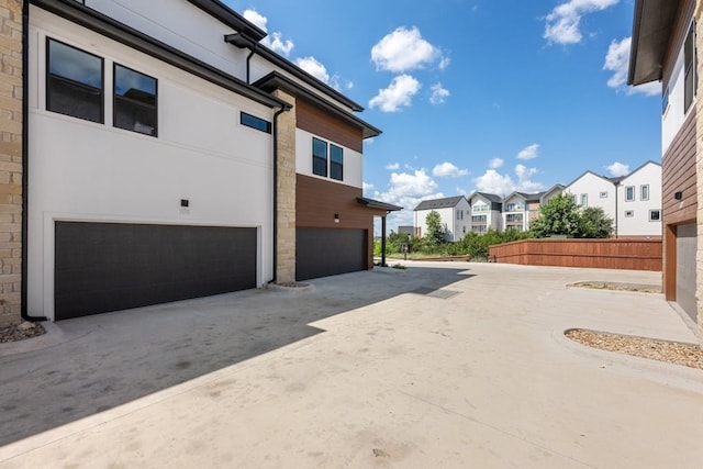 view of property exterior featuring a garage