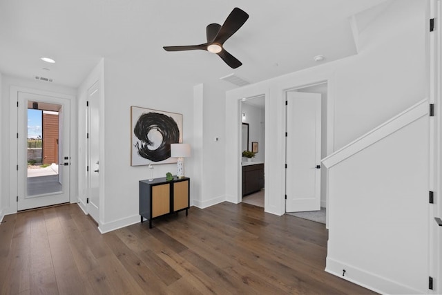 entryway with dark hardwood / wood-style floors and ceiling fan