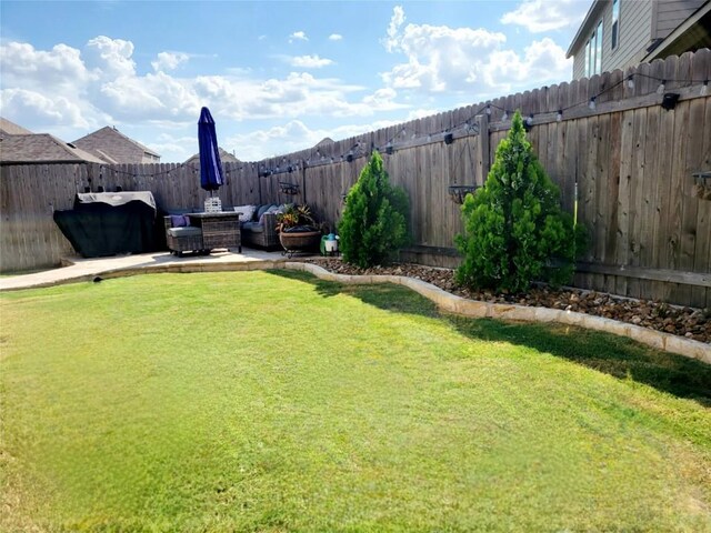 view of yard with outdoor lounge area and a patio