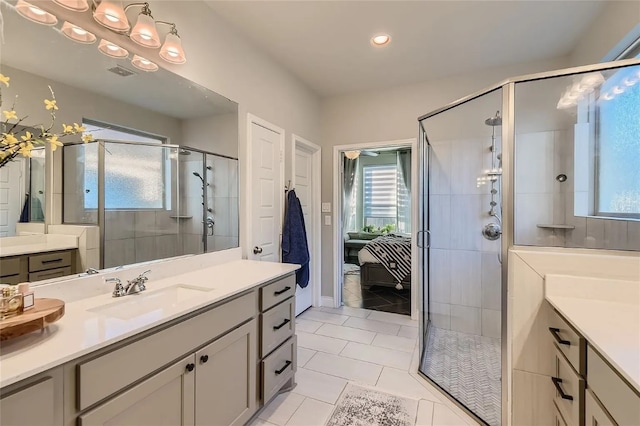 bathroom featuring tile patterned floors, vanity, and walk in shower