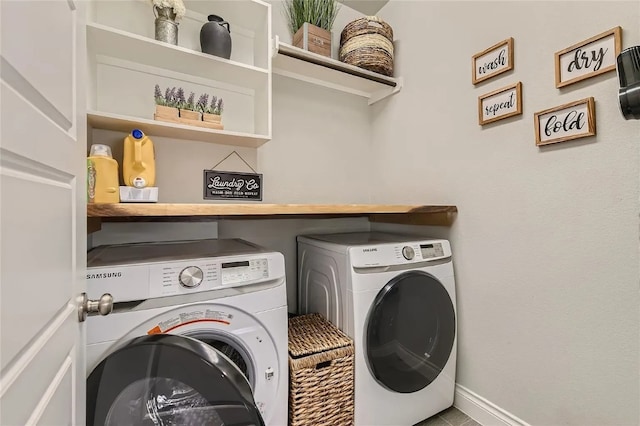 washroom featuring washing machine and clothes dryer