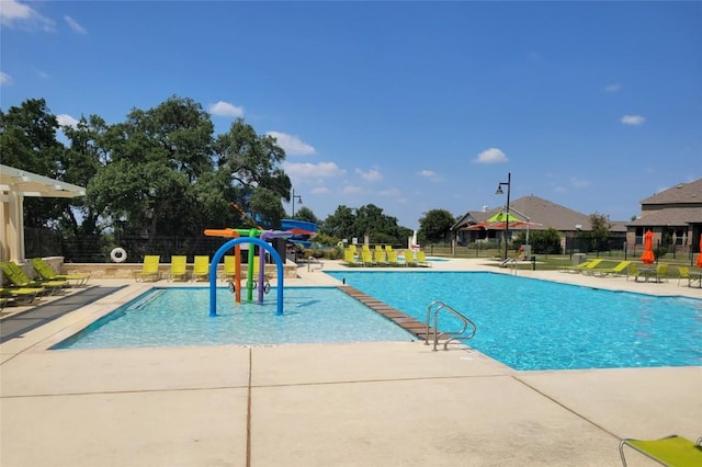 view of swimming pool with a patio area