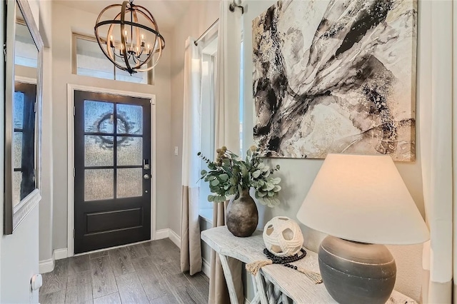 242 Freeman Loop, Liberty Hill, TX 78642 - entrance foyer with a chandelier and wood finished floors