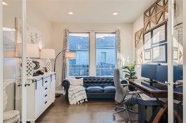 home office with dark hardwood / wood-style flooring