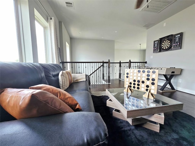 242 Freeman Loop, Liberty Hill, TX 78642 - living area featuring wood finished floors and baseboards
