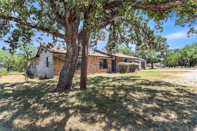 exterior space featuring a yard and a garage