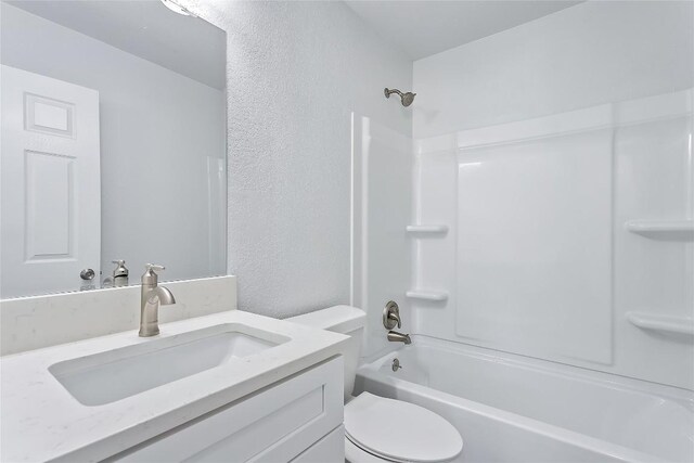 full bathroom featuring vanity, toilet, and shower / washtub combination