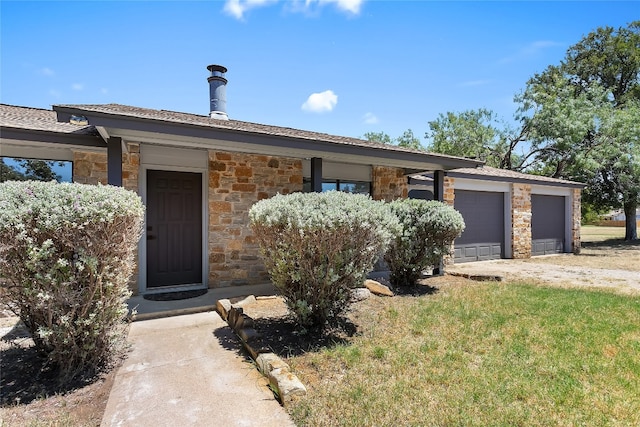 ranch-style house featuring a garage