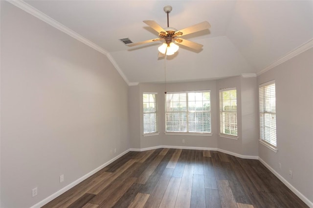 spare room featuring lofted ceiling, crown molding, dark wood-type flooring, and ceiling fan