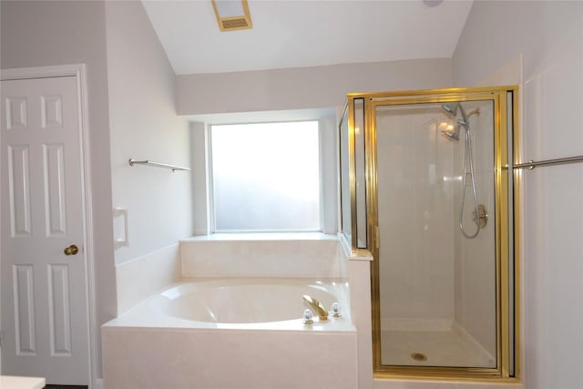 bathroom with shower with separate bathtub