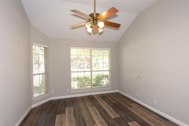 empty room featuring lofted ceiling, dark wood-type flooring, and ceiling fan