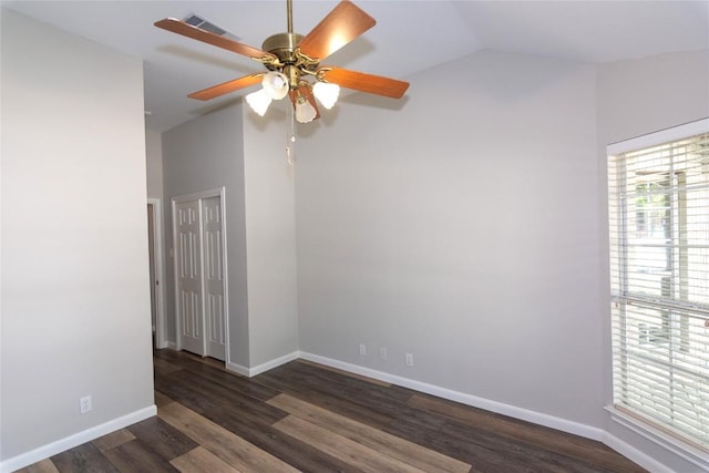 unfurnished room featuring vaulted ceiling, ceiling fan, and dark hardwood / wood-style flooring