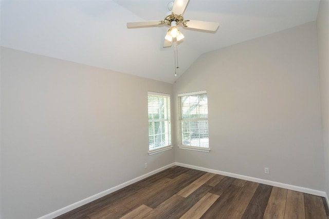 unfurnished room featuring dark wood-type flooring, ceiling fan, and vaulted ceiling