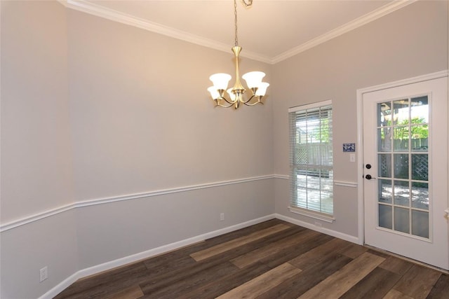 unfurnished dining area with crown molding, dark hardwood / wood-style floors, and a chandelier