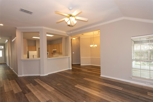 empty room featuring ornamental molding, vaulted ceiling, and dark hardwood / wood-style flooring