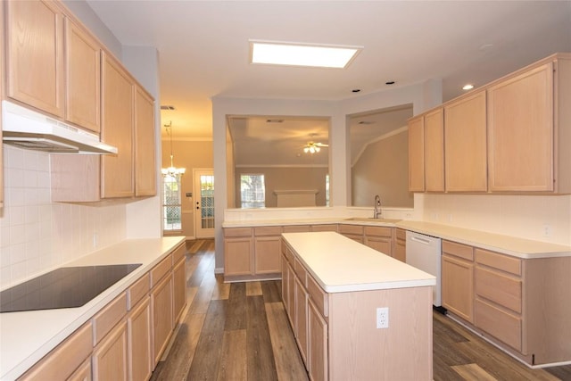 kitchen with light brown cabinetry, dishwasher, sink, a center island, and black electric stovetop