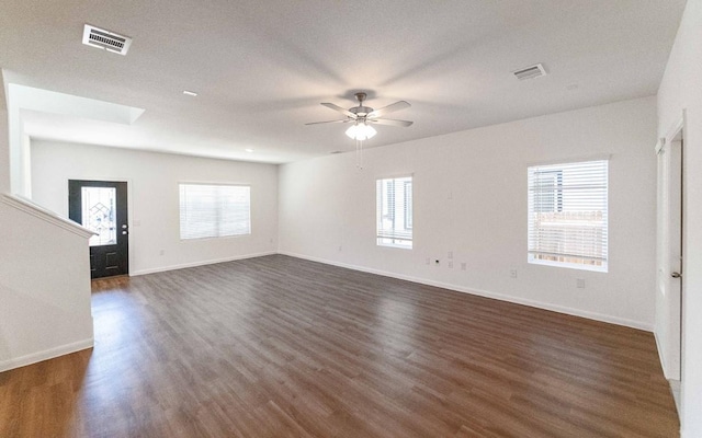 215 Tokalaun Dr, Hutto, TX 78634 - spare room with plenty of natural light, dark wood-type flooring, and ceiling fan