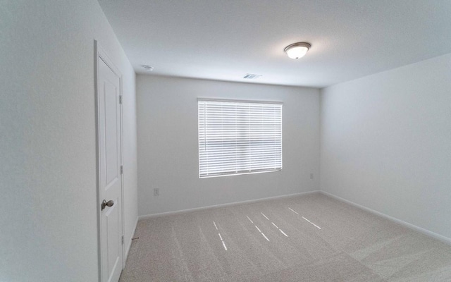 215 Tokalaun Dr, Hutto, TX 78634 - empty room with carpet and baseboards