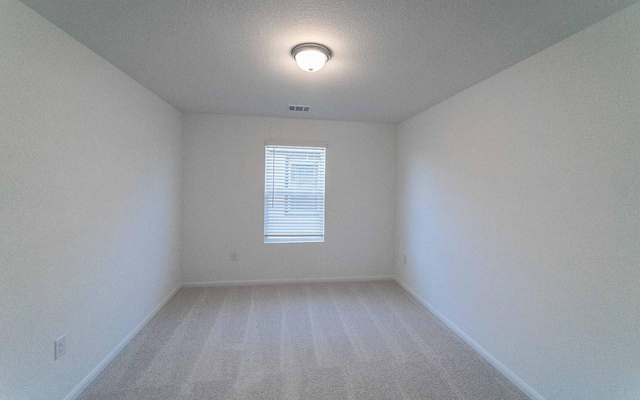 215 Tokalaun Dr, Hutto, TX 78634 - empty room featuring baseboards and light colored carpet