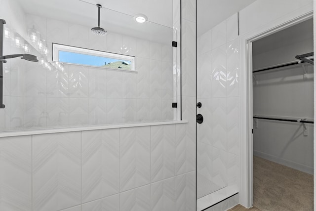 bathroom with tiled shower