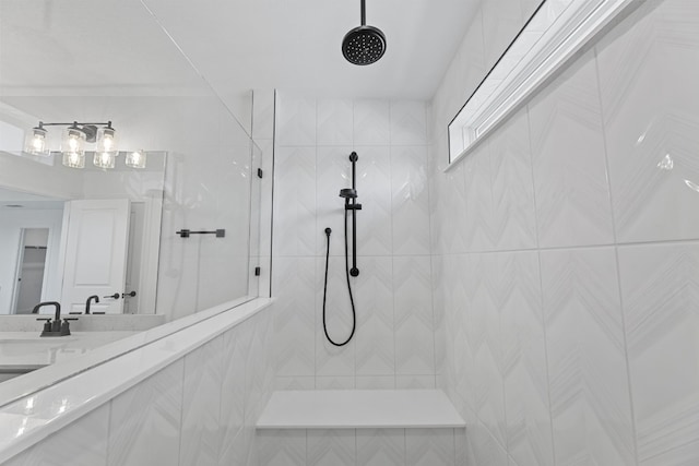 bathroom featuring sink and tiled shower