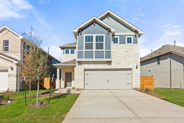 view of front of home featuring a garage and a front yard