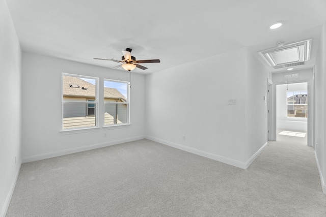 carpeted spare room with ceiling fan and a healthy amount of sunlight