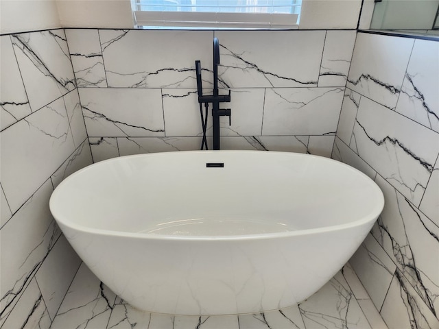 interior details featuring tile patterned flooring and a washtub