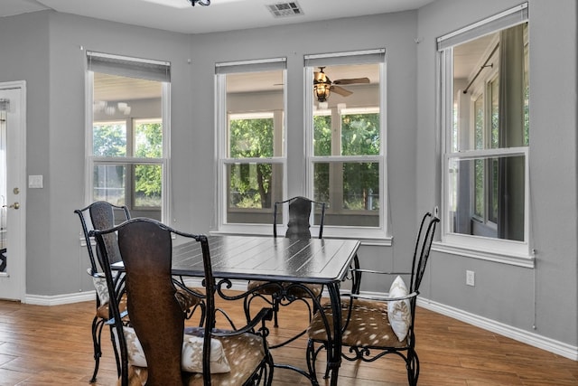 dining area featuring hardwood / wood-style floors and ceiling fan