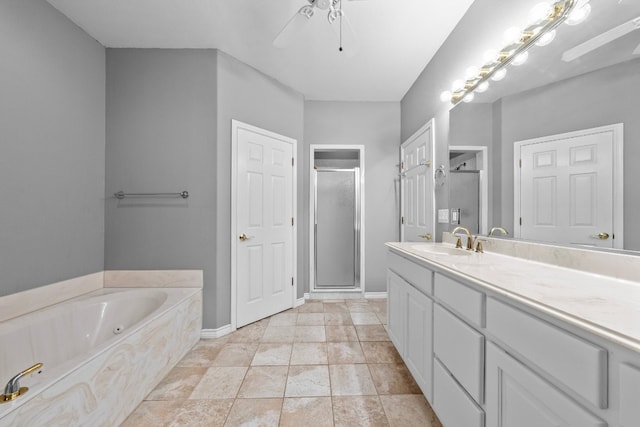 bathroom featuring tile patterned flooring, shower with separate bathtub, and vanity