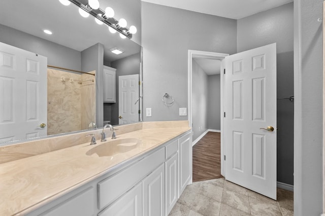 bathroom with tile patterned flooring and vanity