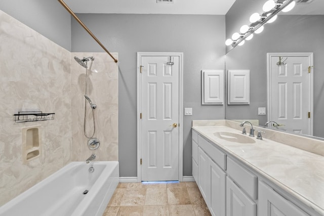 bathroom with tile patterned floors, vanity, and tiled shower / bath combo