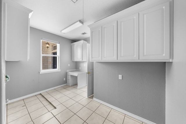 laundry room with light tile patterned floors