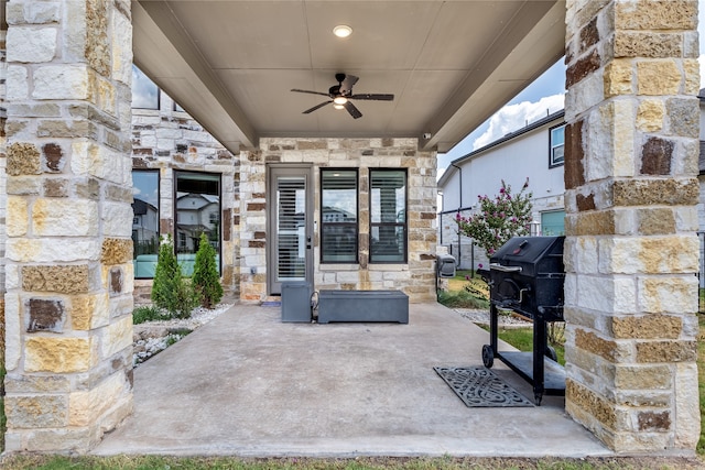 view of patio / terrace with ceiling fan and area for grilling