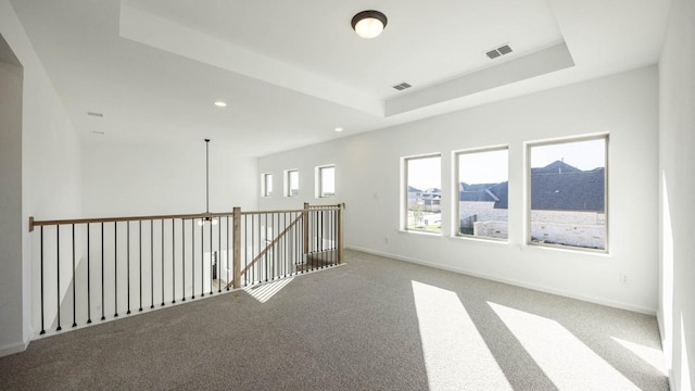 201 Menlo Bnd, Liberty Hill, TX 78642 - carpeted empty room featuring a raised ceiling and recessed lighting