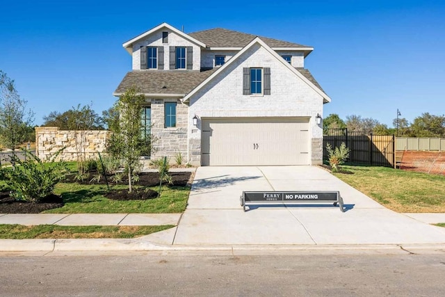 201 Menlo Bnd, Liberty Hill, TX 78642 - view of front of property featuring driveway, an attached garage, roof with shingles, and stone siding