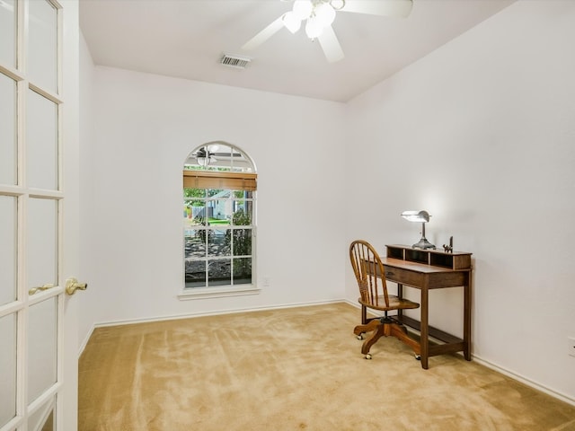 carpeted office featuring ceiling fan