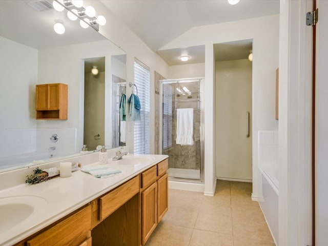 bathroom featuring tile patterned floors, independent shower and bath, and vanity