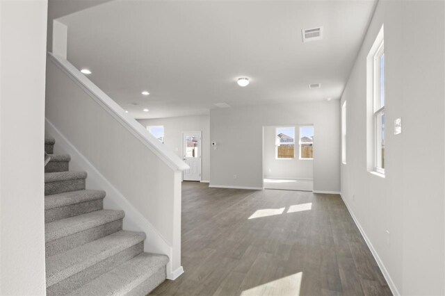 foyer entrance with dark wood-type flooring