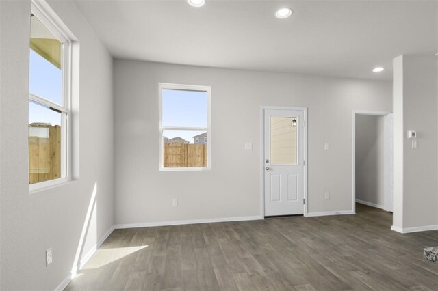 spare room featuring dark hardwood / wood-style floors