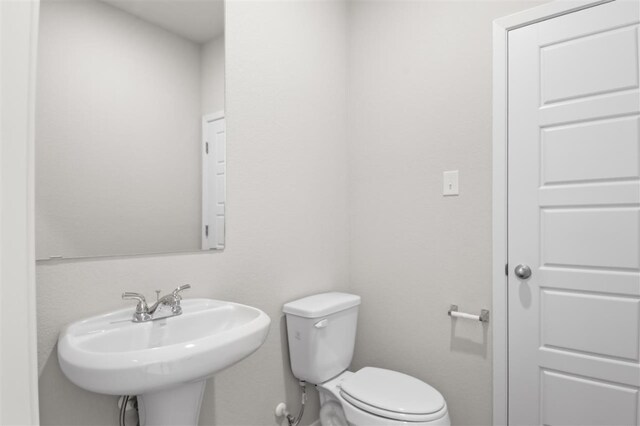 bathroom with toilet and sink