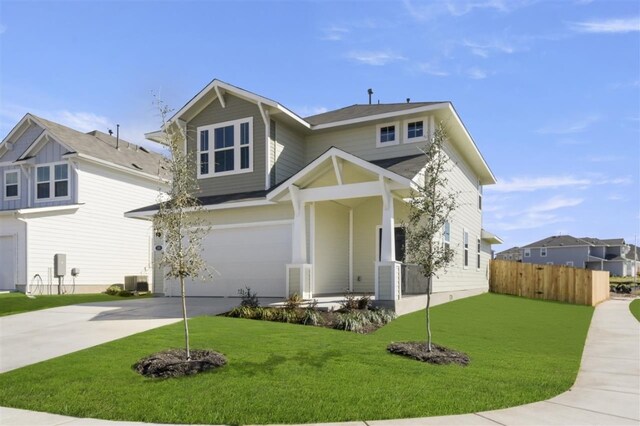 view of front of home featuring a front yard and a garage