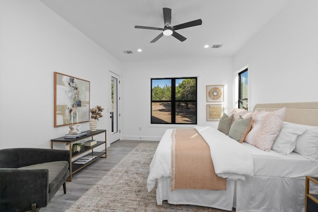 bedroom featuring wood-type flooring, access to outside, and ceiling fan