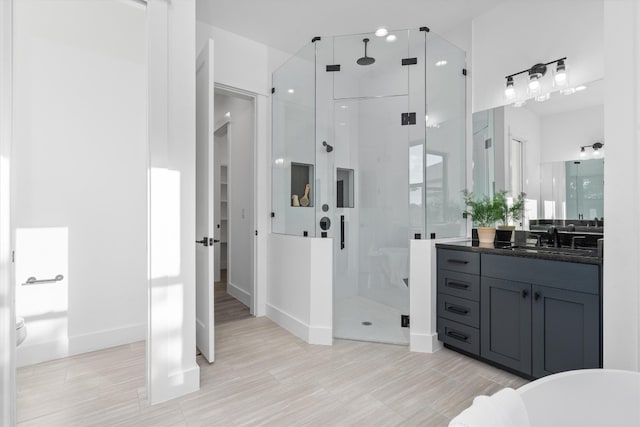 bathroom with shower with separate bathtub, vanity, and wood-type flooring