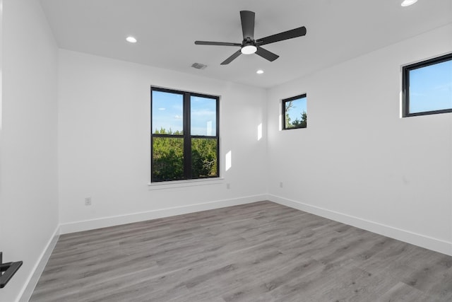 unfurnished room featuring ceiling fan and light hardwood / wood-style floors