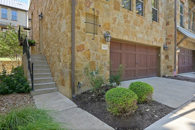 view of side of property with a garage