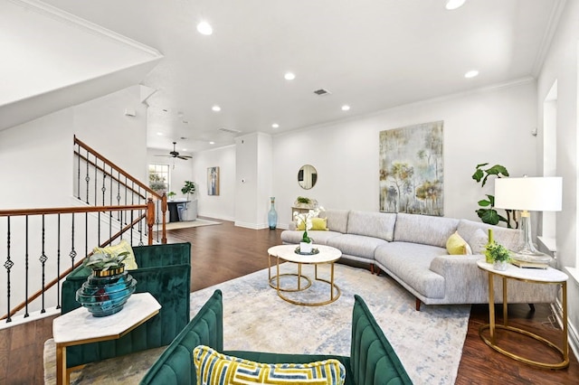 living room featuring ceiling fan, dark hardwood / wood-style floors, and ornamental molding